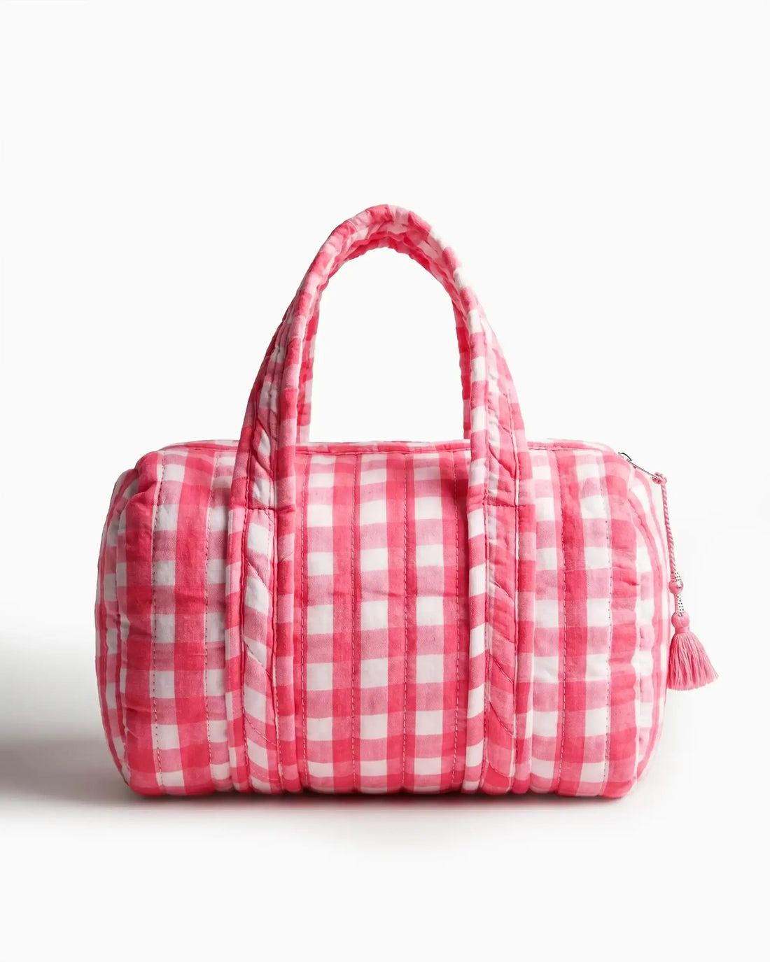 Pink gingham vanity bag with quilted texture and soft handles, featuring a side zipper with a tassel placed on a plain white background | Singhvis