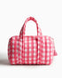 Pink gingham vanity bag with quilted texture and soft handles, featuring a side zipper with a tassel placed on a plain white background | Singhvis